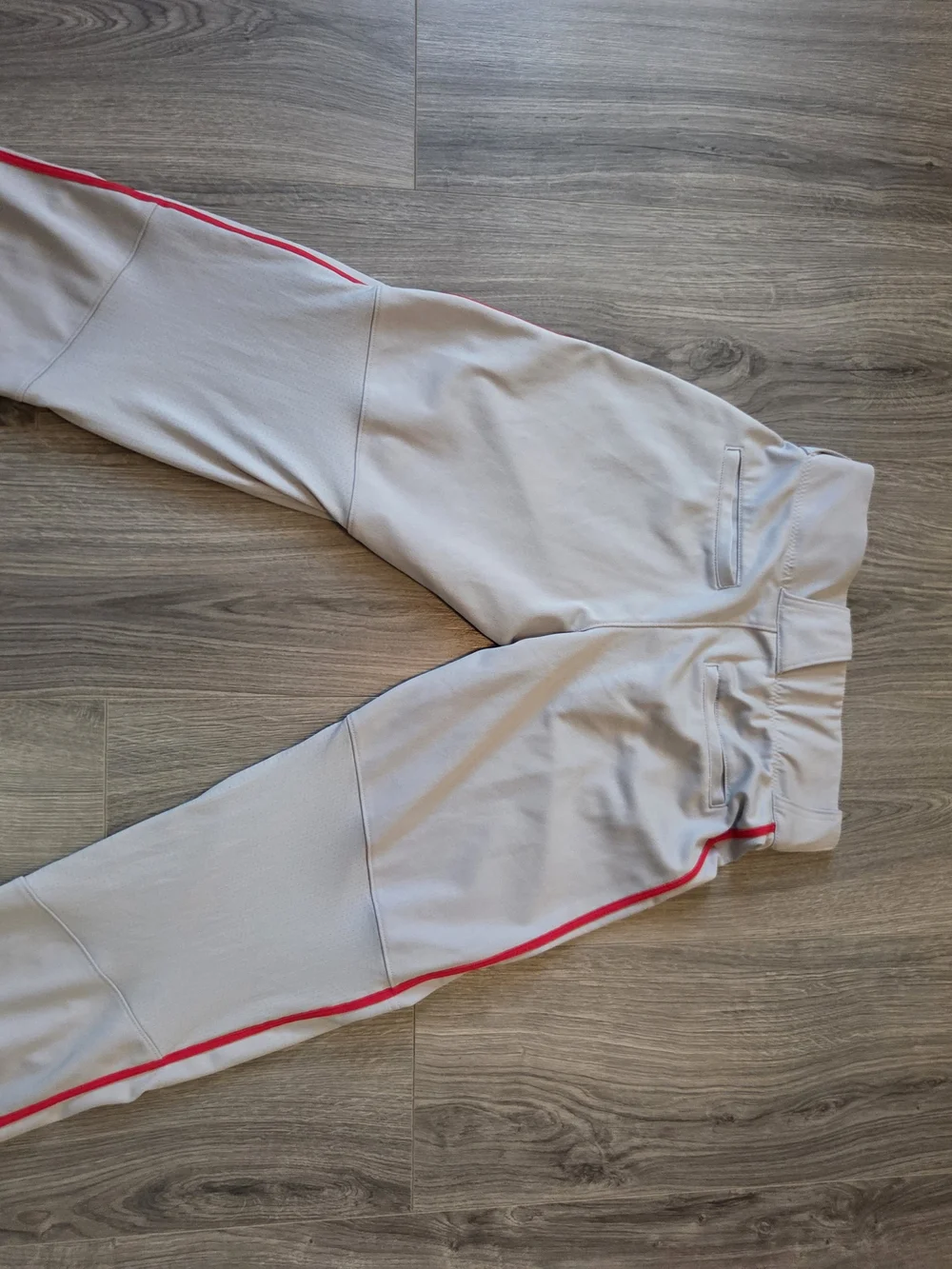 Nike Light Gray Baseball Pants with Red Swoosh Accent